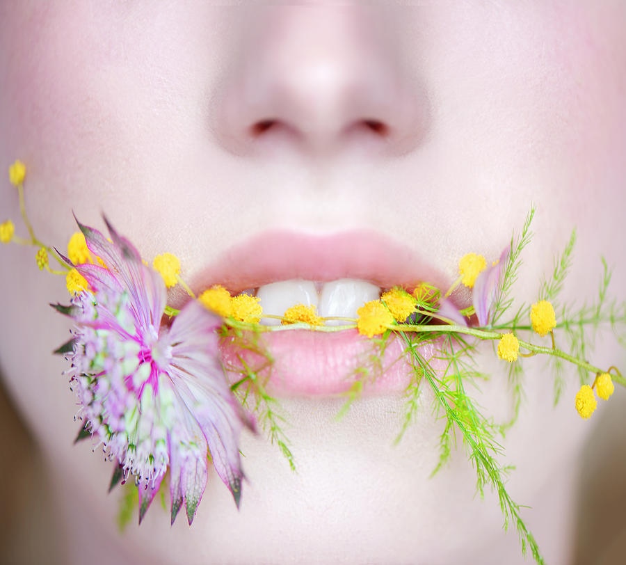 Woman With Flowers In Mouth Photograph by Tara Moore