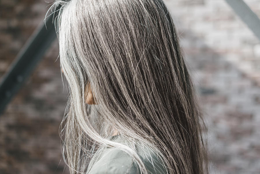 Woman with long grey hair Photograph by Westend61