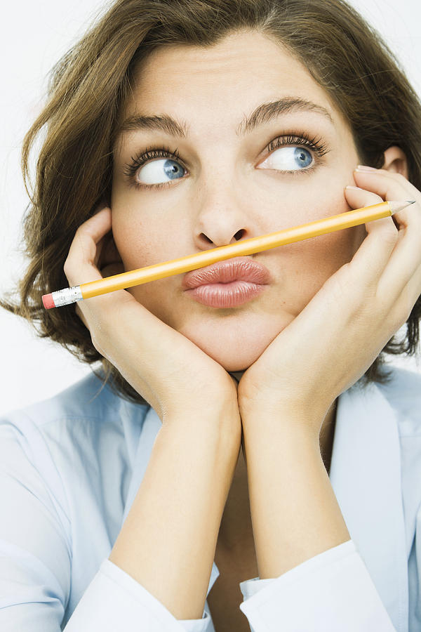 Woman with pencil between lip and nose Photograph by Pando Hall