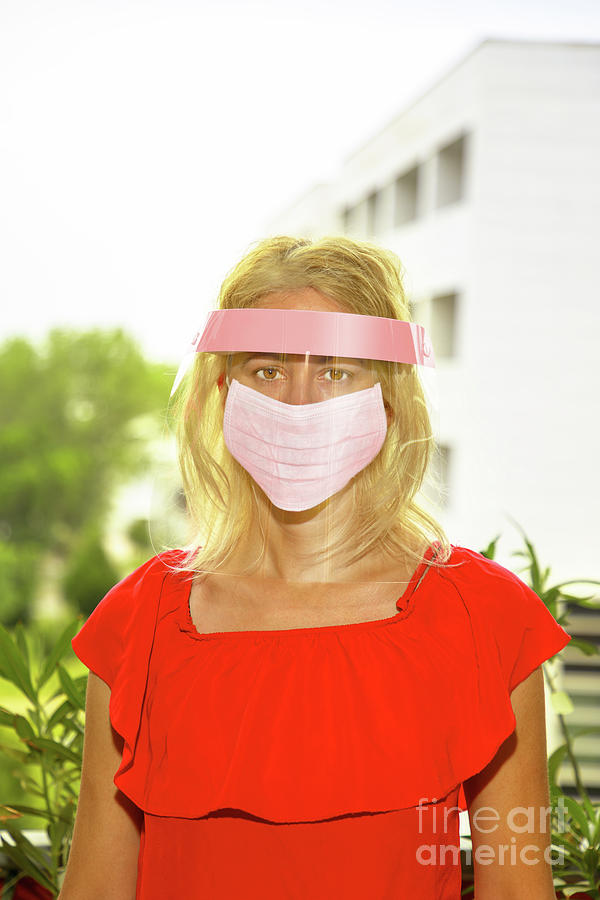 Woman with protective visor and mask Photograph by Benny Marty