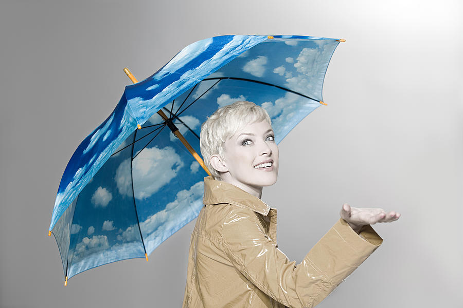 Woman with umbrella Photograph by Image Source