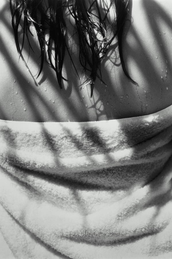 Woman with wet hair, towel wrapped around body, rear view (B&W) Photograph by Terry Vine