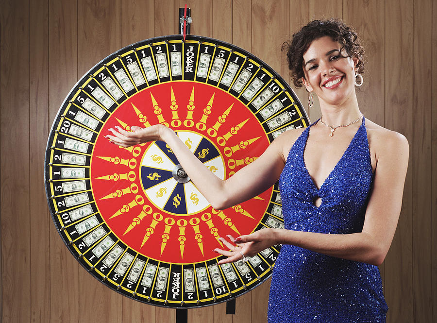 Woman with Wheel of Fortune Photograph by Leland Bobbe