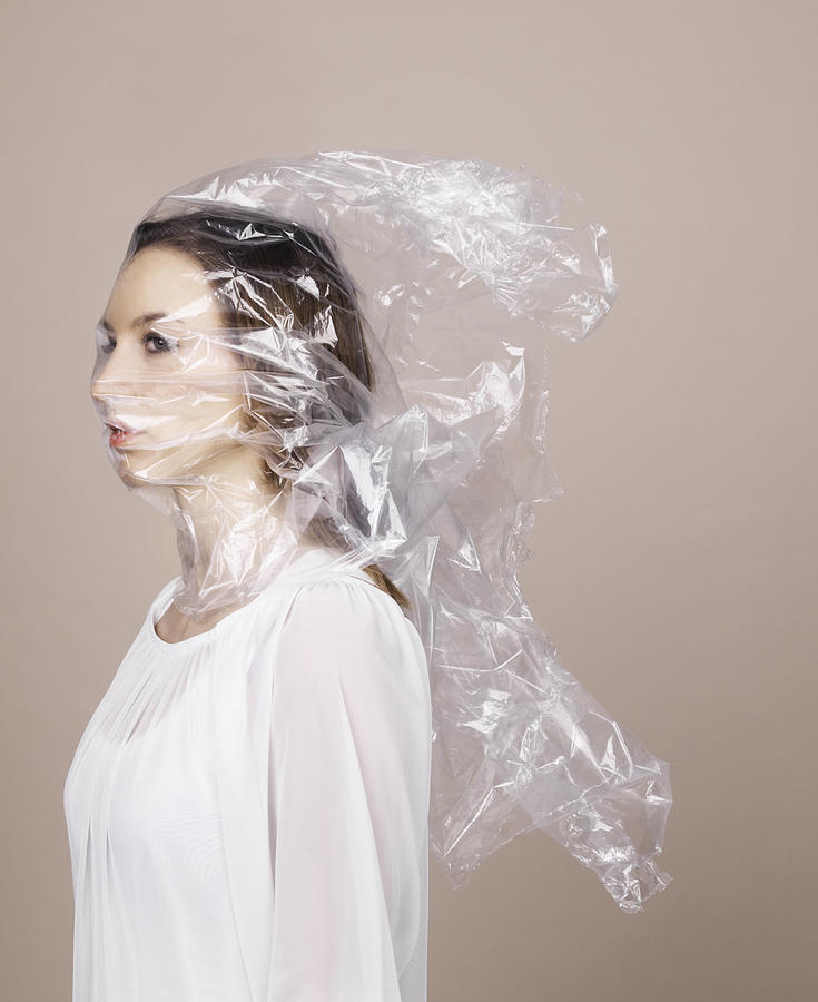 Woman wrapped in plastic Photograph by Henrik Sorensen