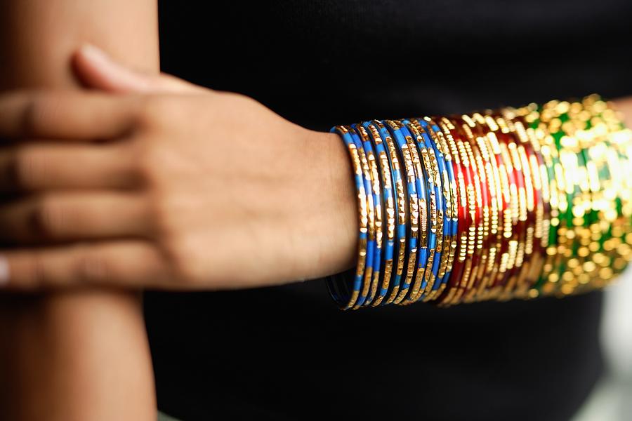 Womans arm with colourful bangles Photograph by Asia Images Group