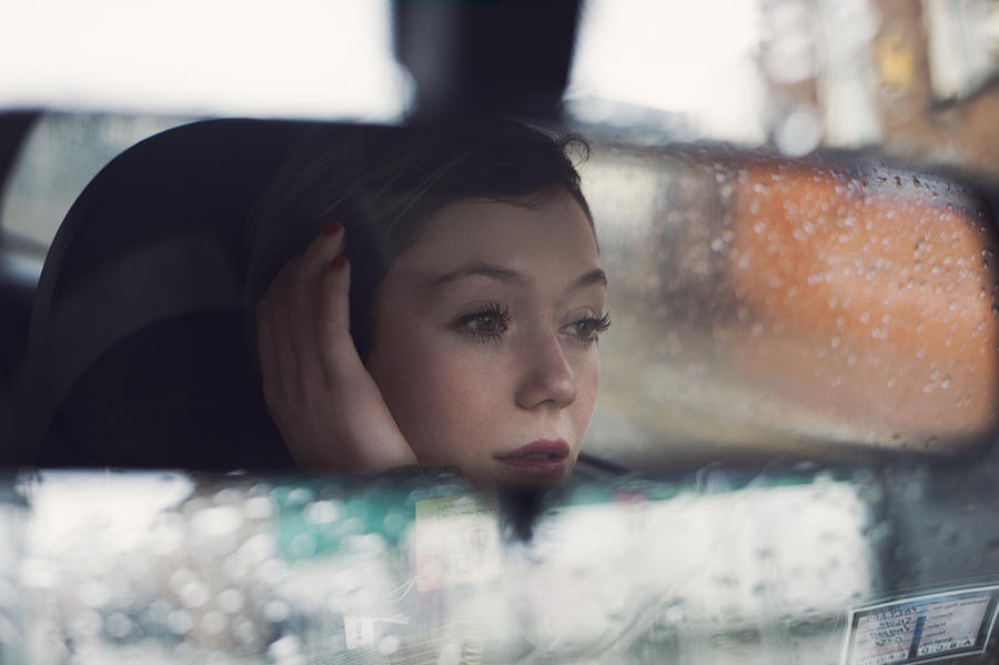 Womans Face Seen In The Rear Mirror Of A Car Photograph by Justin Case