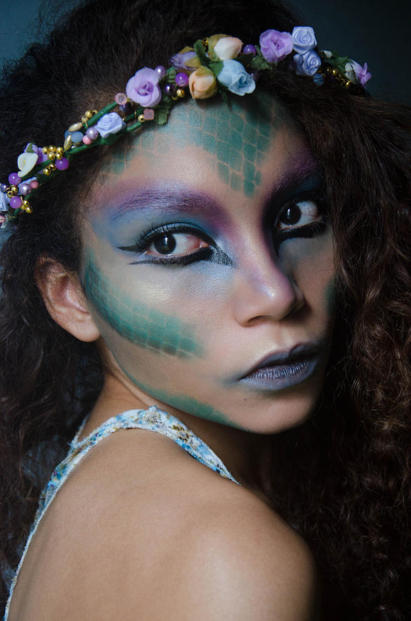 Womans portrait wearing fantasy makeup. Photograph by Elizabeth Fernandez