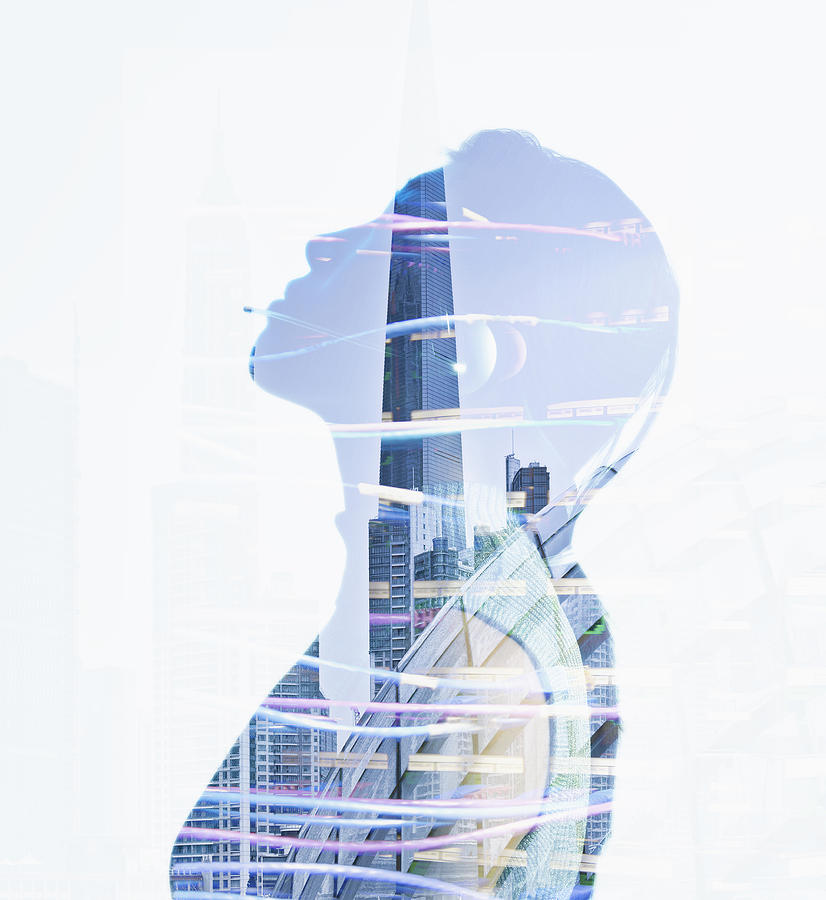 Womans silhouette in reflection of city skyscrapers Photograph by Colin Anderson Productions pty ltd
