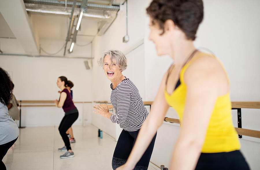 Women enjoying a dance routine in fitness studio Photograph by Luis Alvarez