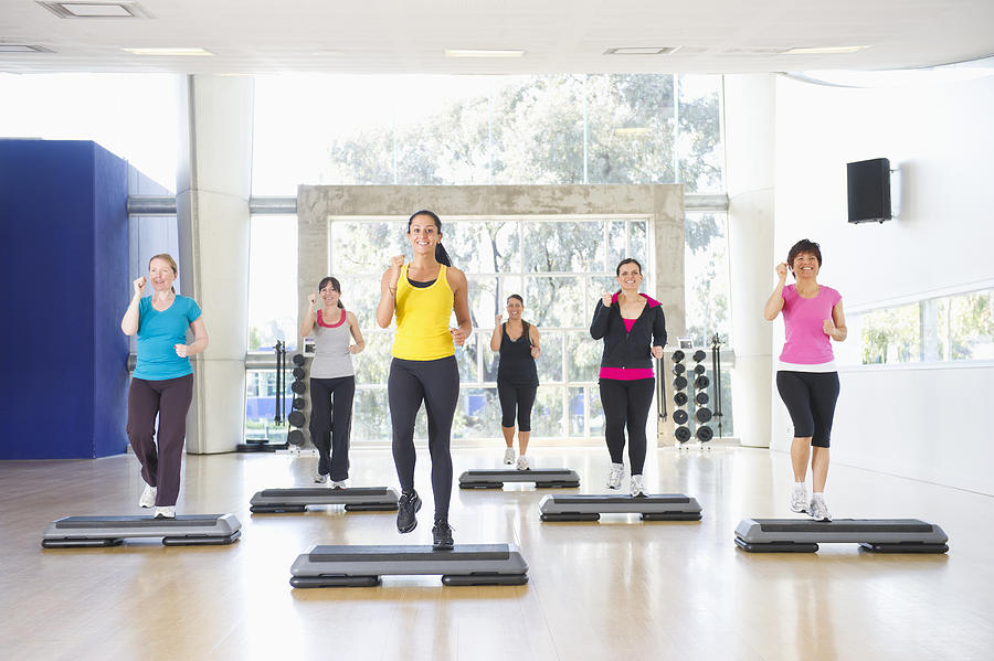Women exercising together in class Photograph by Jacobs Stock Photography Ltd