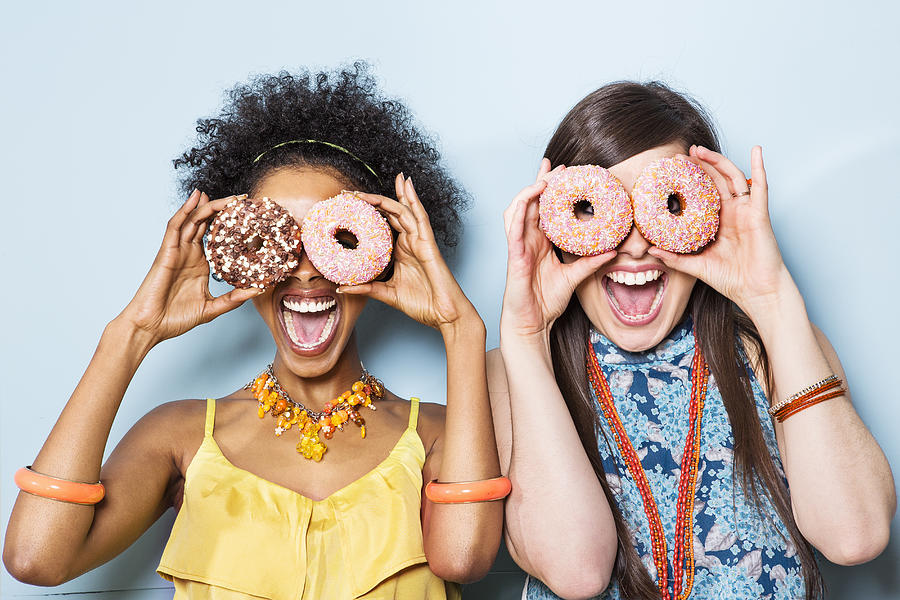 Women Holding Doughnuts In Front Of Eyes. Photograph by Betsie Van Der Meer