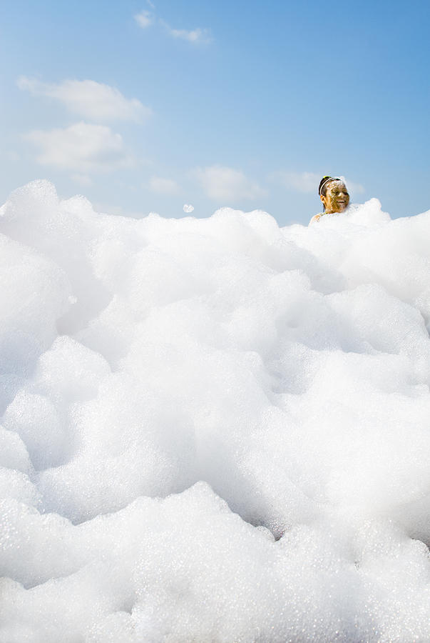 Women in detergent foam at Mud Run. Photograph by Pete Starman