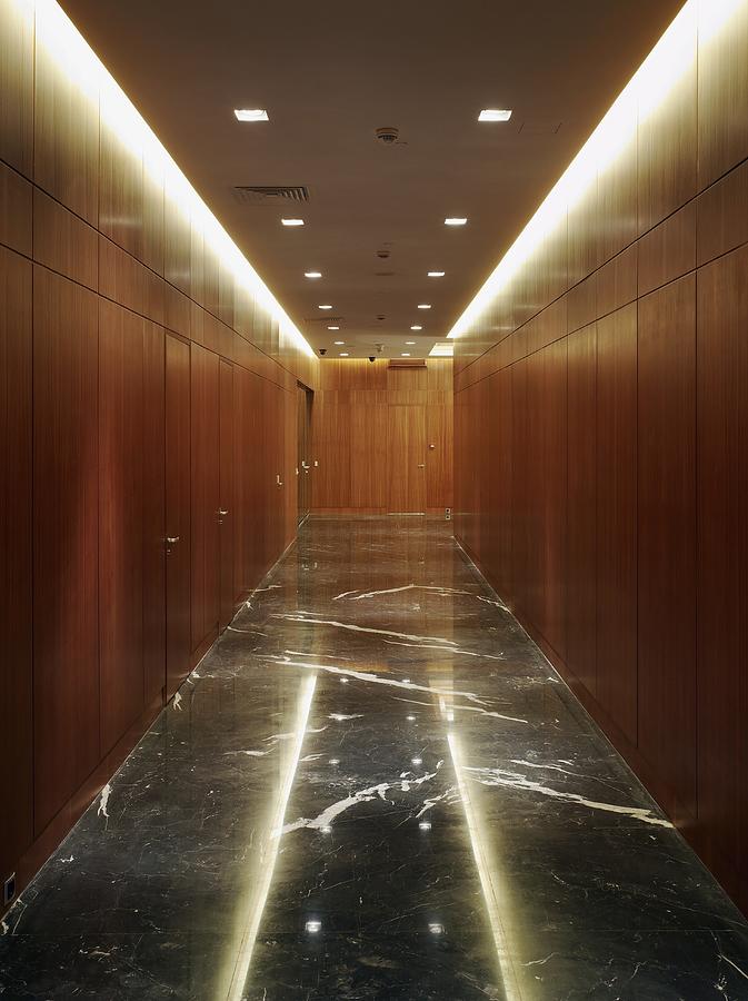 Wood paneled hallway with marble floor Photograph by George Hammerstein/Fuse