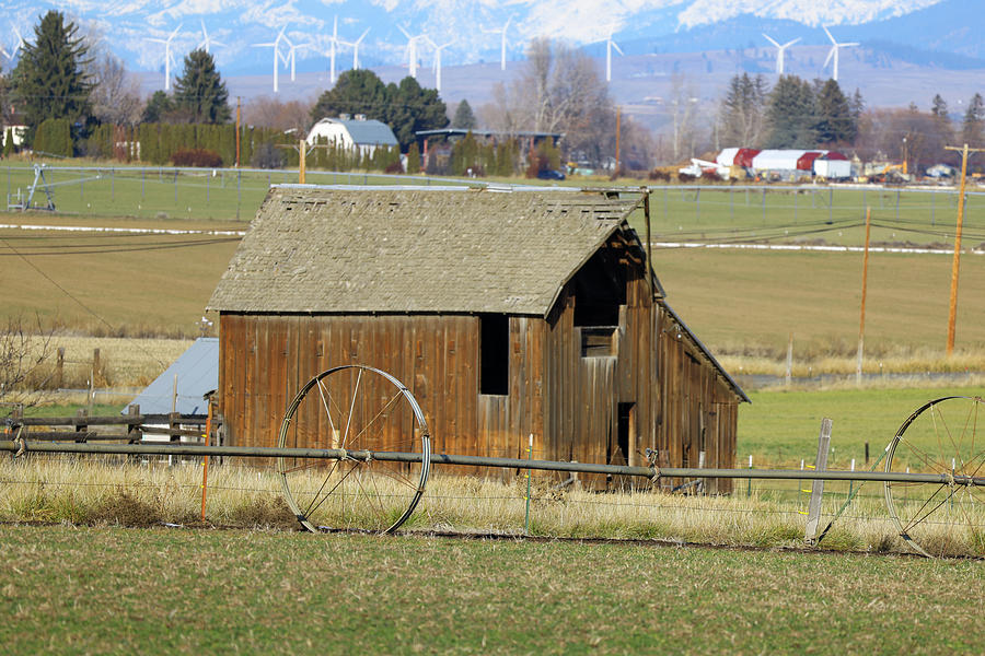 Wooden barn and empty fields Photograph by Jeff Swan