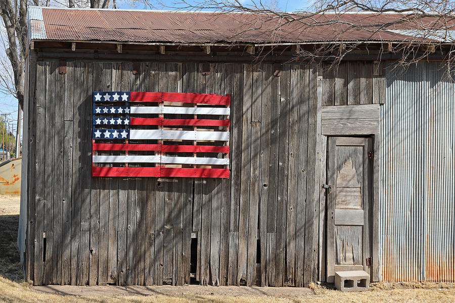 Wooden barn with wooden American flag Photograph by Rainer Grosskopf