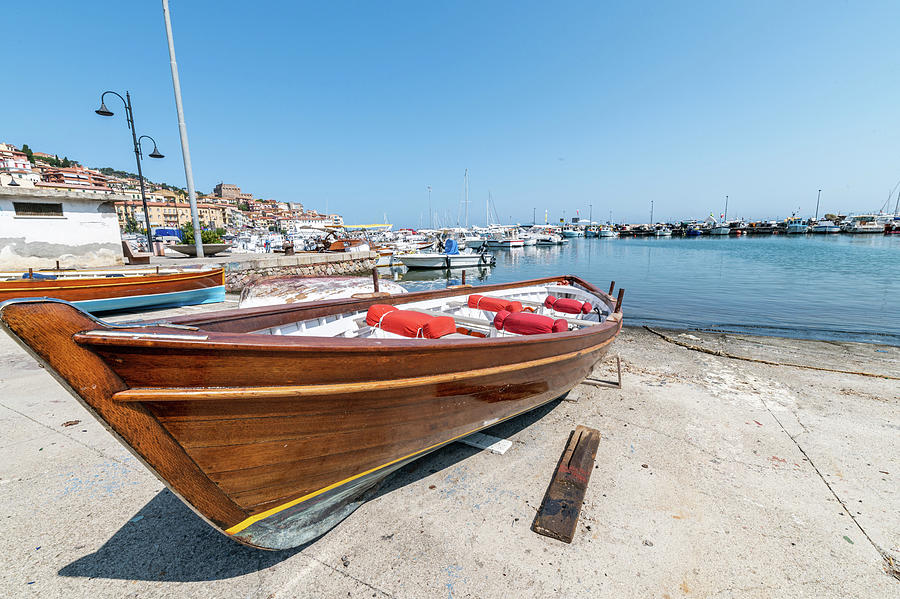 Wooden Boat On The Lolo Of Porto Santo Stefano Photograph by Cardaio ...