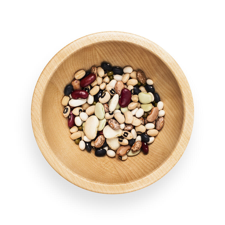 Wooden bowl of assorted dried beans Photograph by Creative Crop