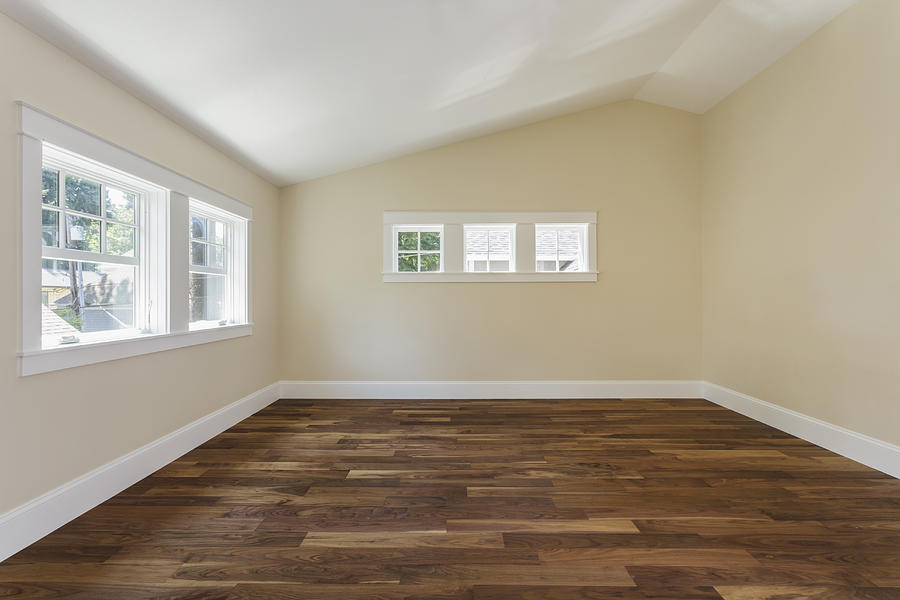 Wooden floor in empty bedroom Photograph by Mint Images