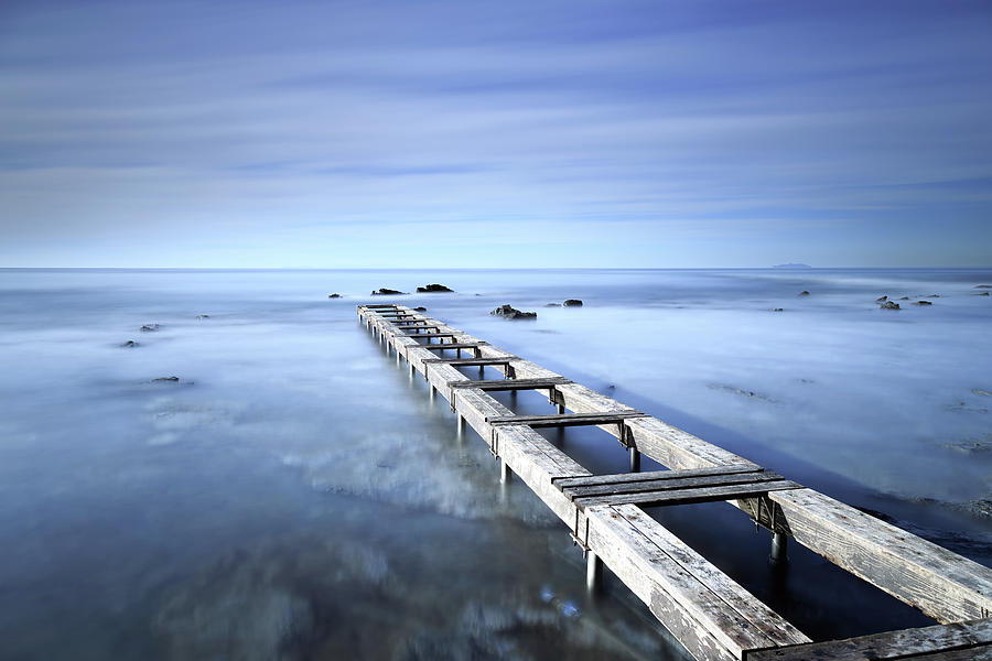 Wooden jetty remains. Long exposure photography Photograph by Stefano Orazzini