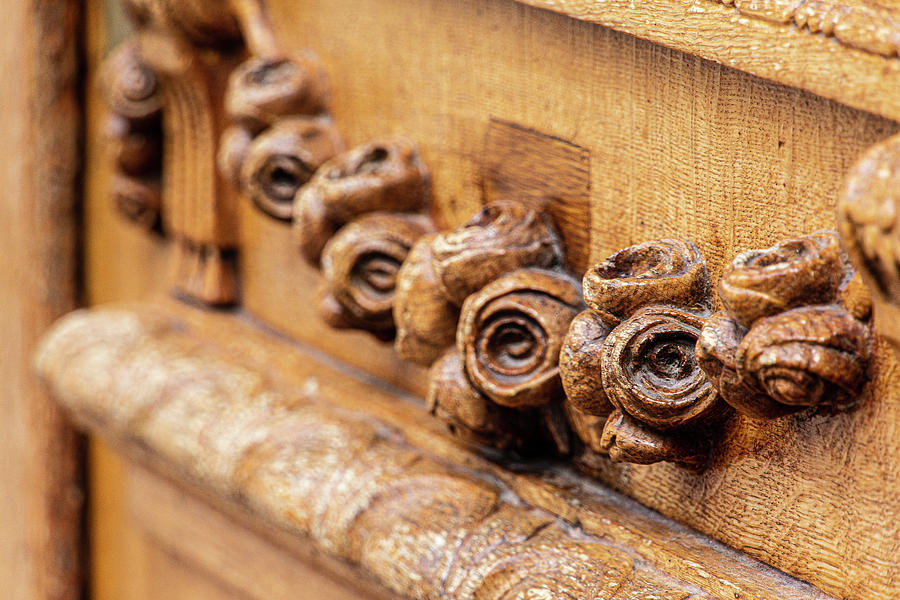 Wooden Roses on Antique Door Photograph by Laura Smith