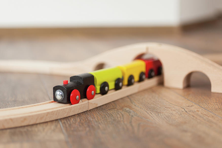 Wooden Toy Train On Railroad With Wooden Bridge. Photograph