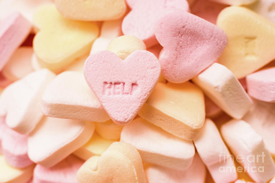 Word Help engraved in a sweet heart-shaped candy, couples therap Photograph by Joaquin Corbalan