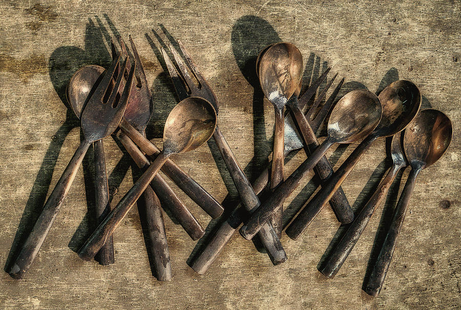 Work In Process Of Bronze Cutlery Forks On Wooden Photograph by