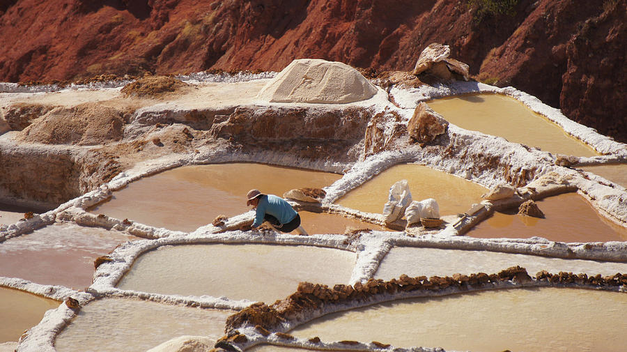 Worker At The Marasal Salt Mines Photograph by La Moon Art