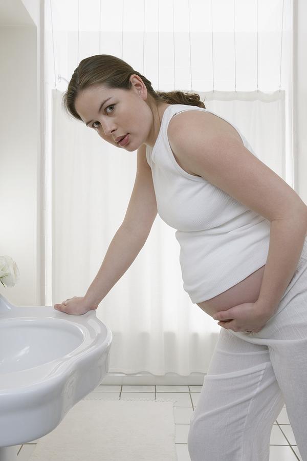 Worried pregnant woman Photograph by Image Source
