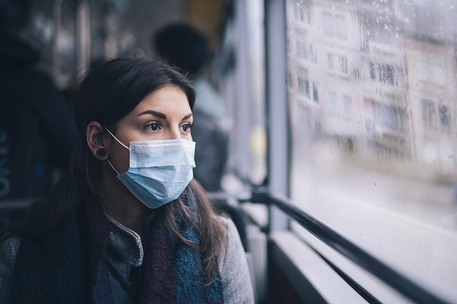 Worried Woman With Protective Face Mask In Bus Transport. Photograph by ArtistGNDphotography