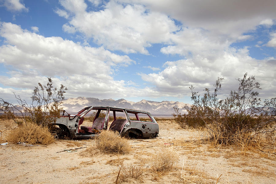 Wrecked car in barren area Photograph by Kyle Monk