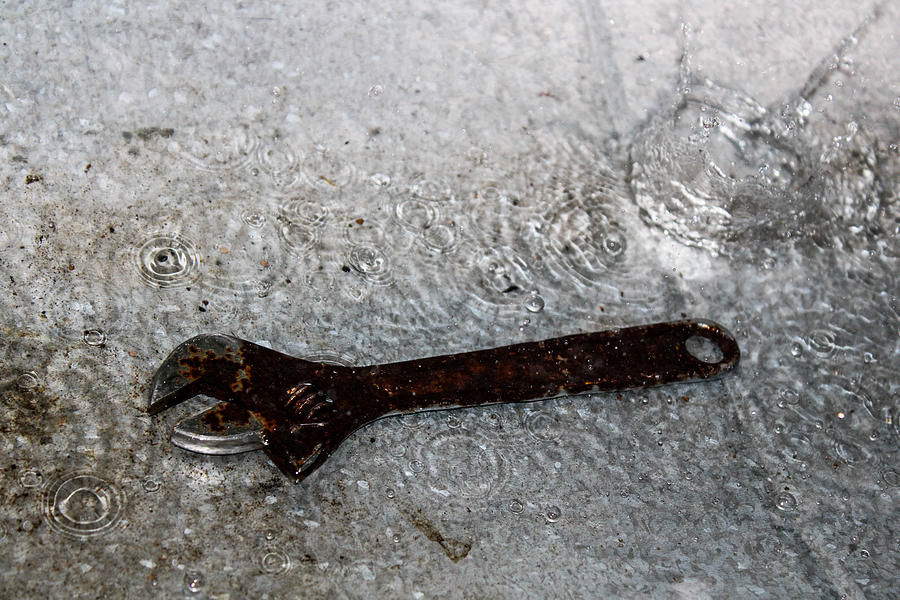 Wrench in a Puddle on Sheet Metal Photograph by W Craig Photography