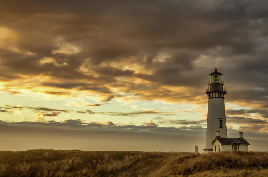Yaquina Head Lighthouse at Sunset Photograph by Don Schwartz