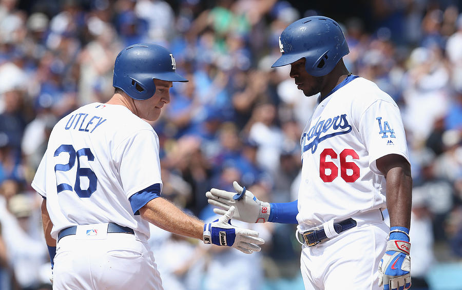 Yasiel Puig and Chase Utley Photograph by Stephen Dunn