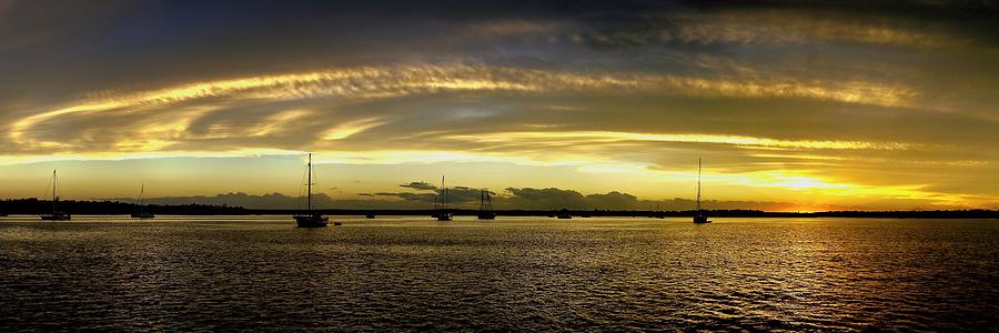 Yellow and gold coloured cirrostratus cloudy coastal nautical Su Photograph by Geoff Childs