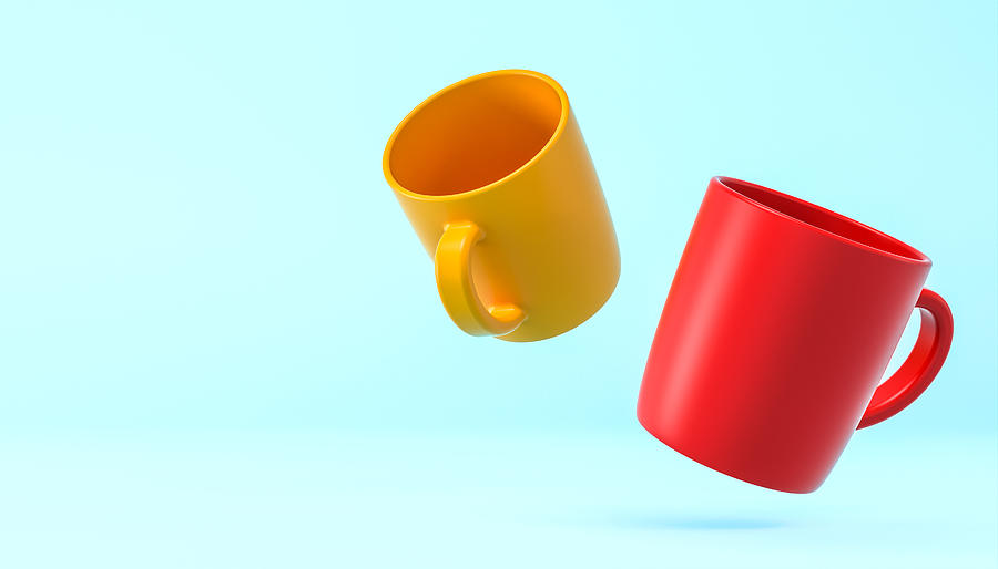 Yellow And Red Cups On A Light Blue Background.  Photograph by Gualtiero Boffi
