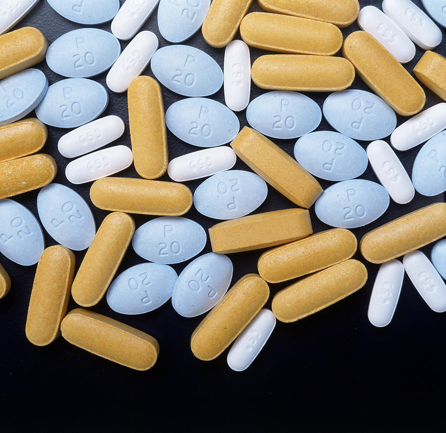 Yellow and; white prescription pills Photograph by Chris Rogers