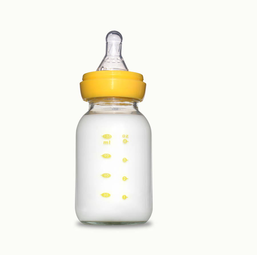 Yellow baby bottle with formula Photograph by Bluehill75