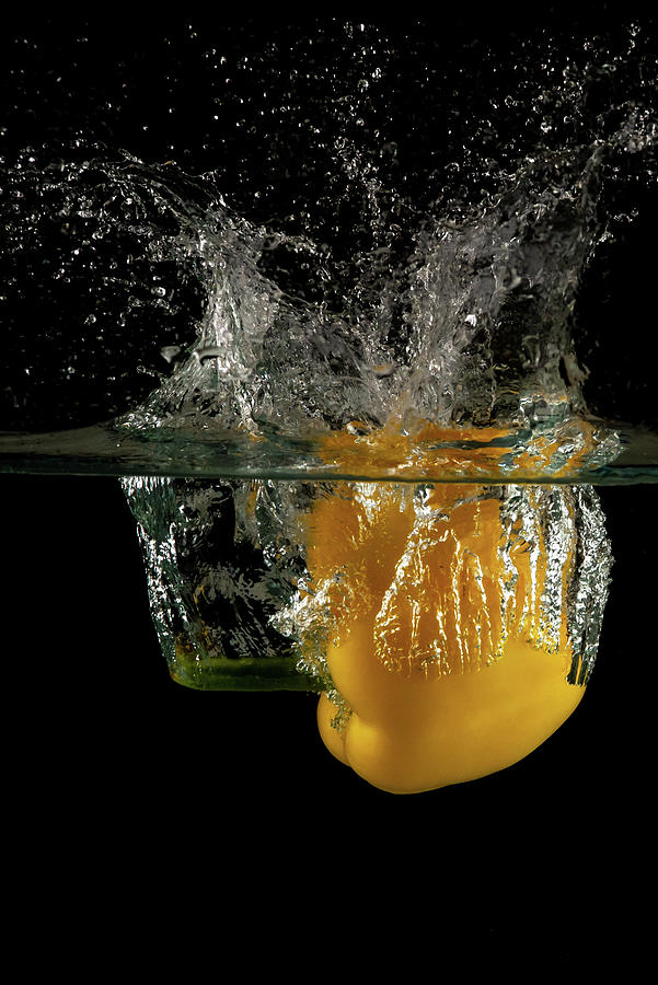Yellow bell pepper dropped and slashing on water Photograph by Michalakis Ppalis