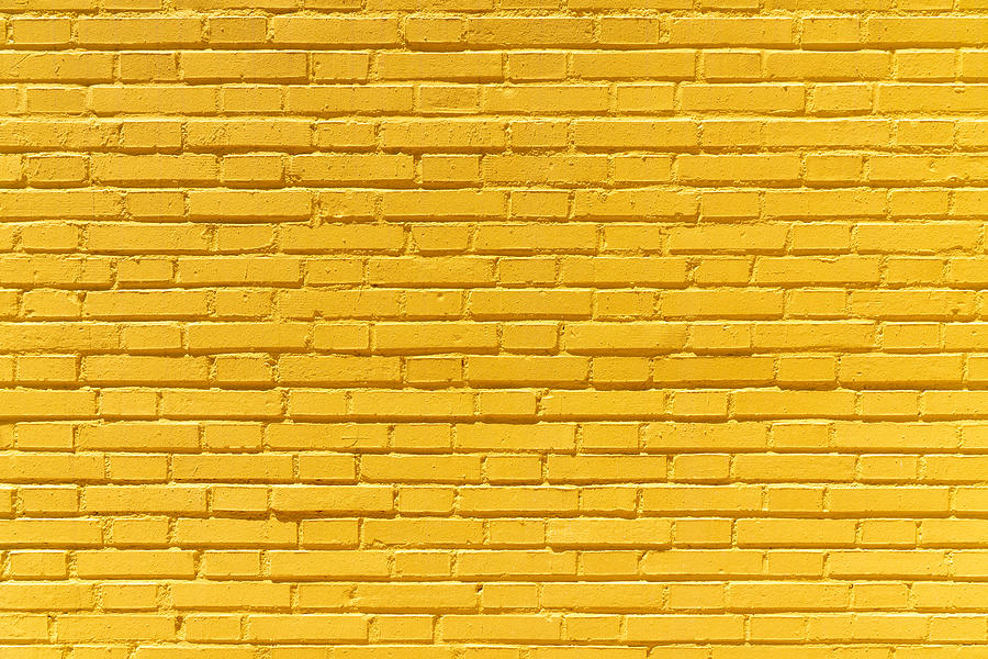 Yellow brick wall background Photograph by Javier Zayas Photography