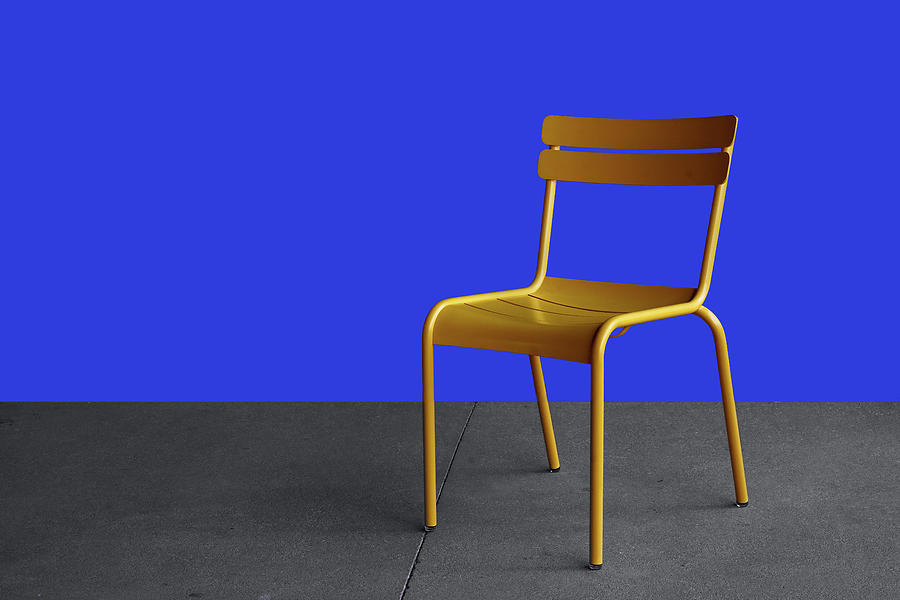 Yellow Chair with Blue Background Photograph by Nikolyn McDonald