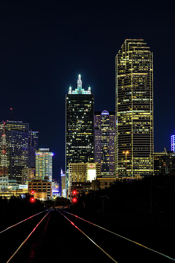 Yellow Dallas Texas skyline at night with train tracks Photograph by ...