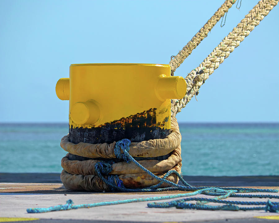 Yellow Dock Bollard at Oranjestad Aruba Photograph by Bill Swartwout