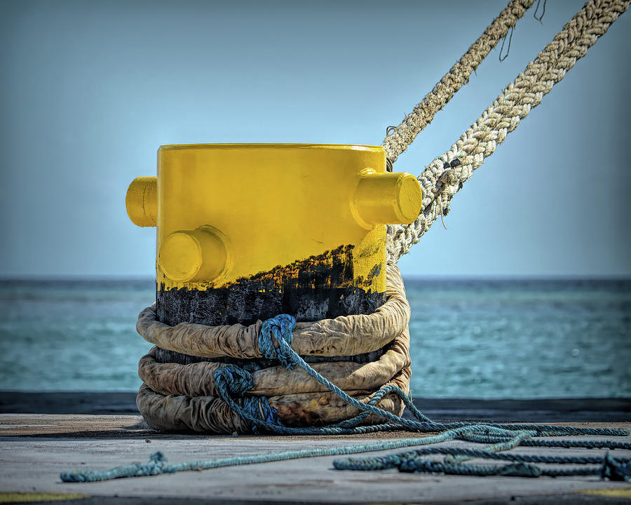 Yellow Dock Bollard Vignette at Oranjestad Photograph by Bill Swartwout