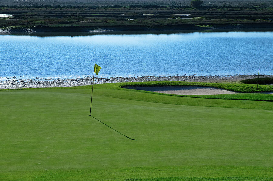 Yellow flag on the Golf Course and Ria Formosa Photograph by Angelo DeVal