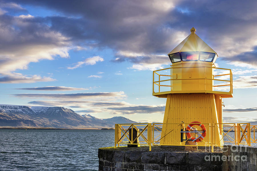 Yellow lighthouse in Reykjavik harbour at sunrise. Early morning Photograph by Jane Rix