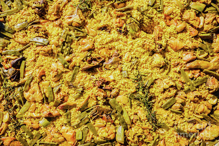 Yellow rice with meat and vegetables, Valencian paella, typical  Photograph by Joaquin Corbalan