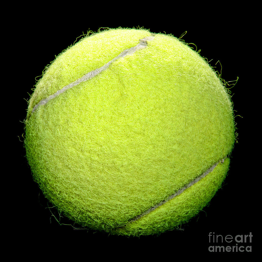Yellow Tennis Ball Isolated on Black Photograph by Olivier Le Queinec