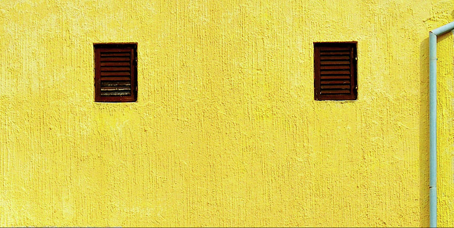 Yellow Wall Two Vents and a Downspout Photograph by James DeFazio