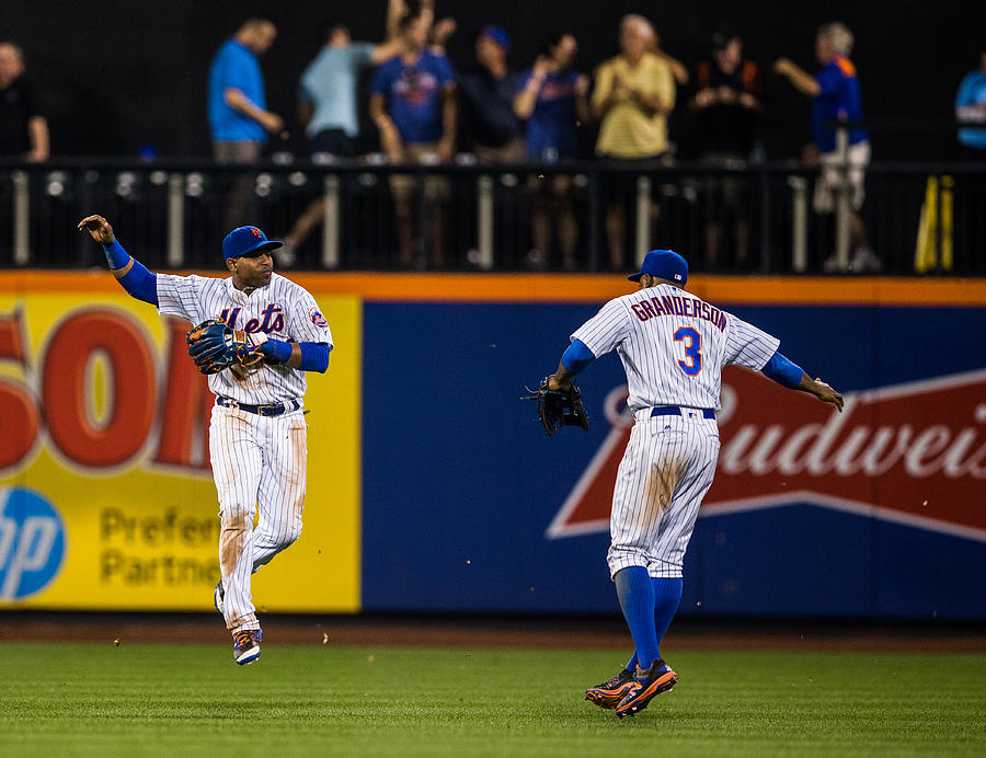 Yoenis Cespedes and Curtis Granderson Photograph by Rob Tringali/Sportschrome
